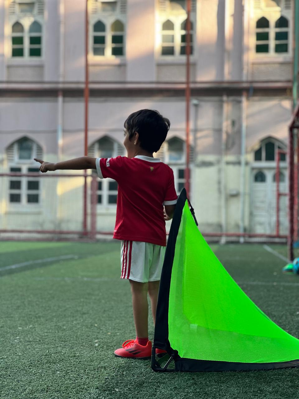 Toddlers learning ball control on the field